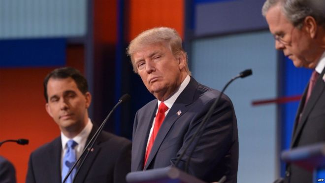 Republican presidential hopeful Donald Trump listens during the prime time Republican presidential primary debate - 6 August 2015
