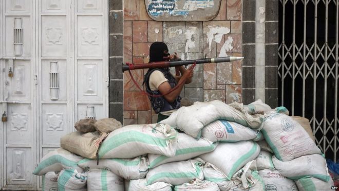 File photo: An Armed Yemeni tribal gunman from the Popular Resistance Committees loyal to Yemen's President Abdrabbuh Mansour Hadi monitors a street in the southern city of Taiz during ongoing clashes with Shia Houthi rebels, 24 May 2015