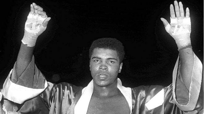 Boxing legend Muhammad Ali with his hands aloft, file pic from 18 November 1963