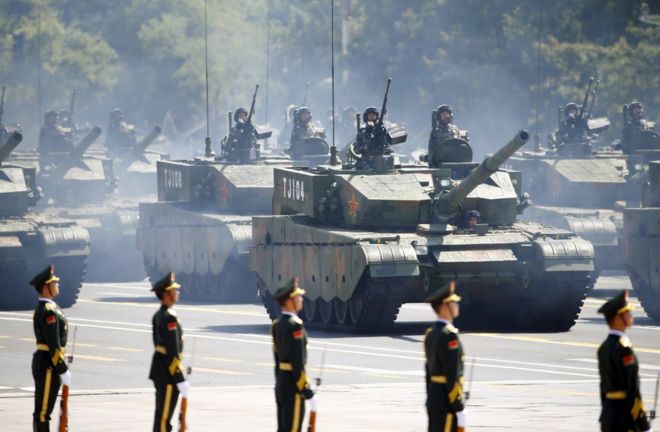 Soldiers of China's People's Liberation Army (PLA) stand in armoured vehicles during the military parade to mark the 70th anniversary of the end of World War Two, in Beijing, China, 3 September 2015