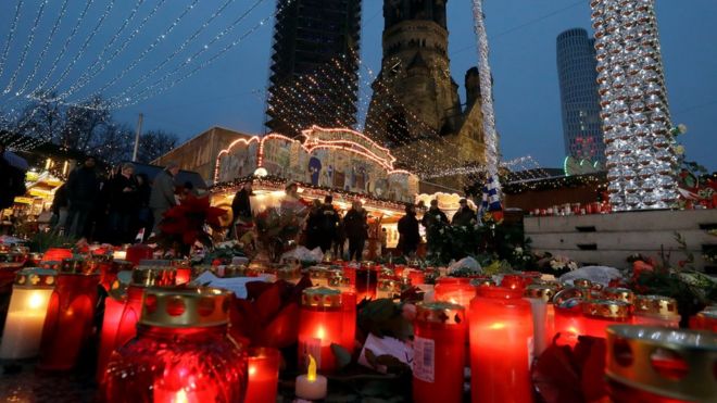 Candles and flowers laid as a tribute at the Breitscheidplatz market in Berlin on 22 December 2016