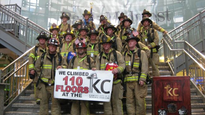 Firefighters pose at a 9/11 memorial in Kansas City, Missouri