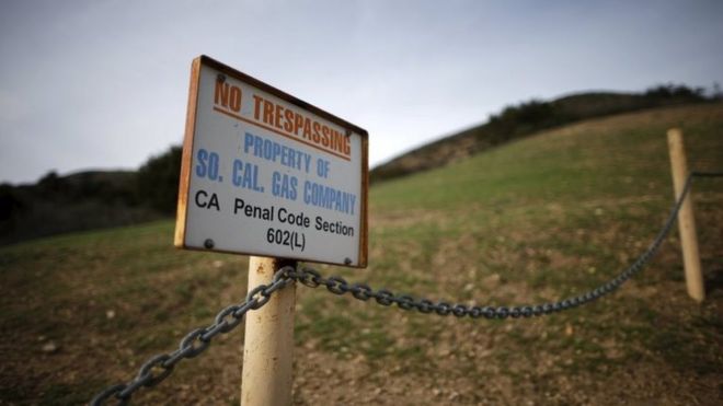 A gas company sign marks a fence near the site of the Aliso Canyon storage field where gas has been leaking in Porter Ranch, California, United States, 21 January 2016.