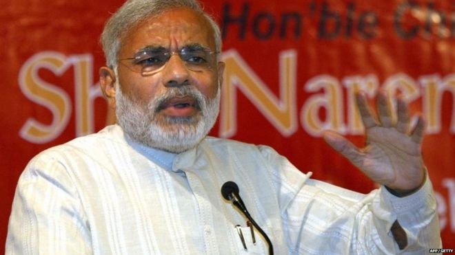 India"s Gujarat state Chief Minister Narendra Modi addresses an audience during the book release ceremony of "History of International Trade and Customs Duties in Gujarat" in Ahmedabad on February 24, 2009