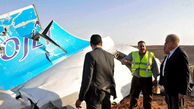 Egyptian Prime Minister Sherif Ismail (right) views the wreckage after the crash (file photo)