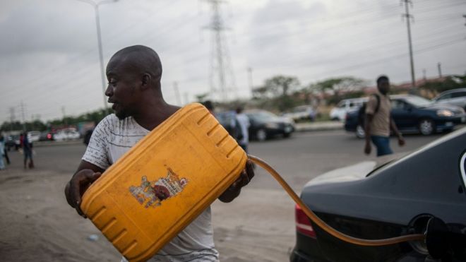 Filling car with fuel in Lagos, Nigeria. 10 April 2016