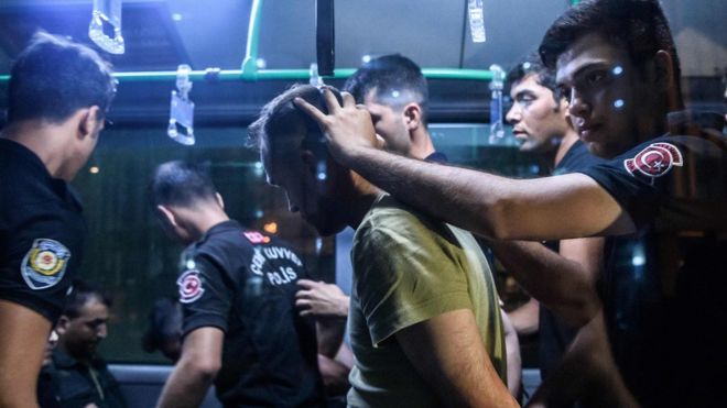 Turkish police detain a soldier in Istanbul on 16 July, 2016