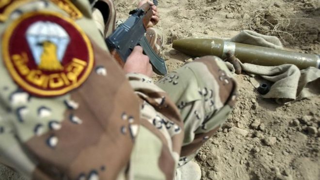 An Iraqi army soldier inspects a Katyusha rocket (21 March 2008)