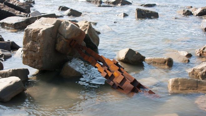 Toppled Gormley statue