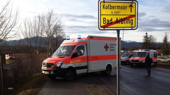Ambulance next to exit sign for Bad Aibling, Bavaria, near train collision, Germany. 9 February 2016