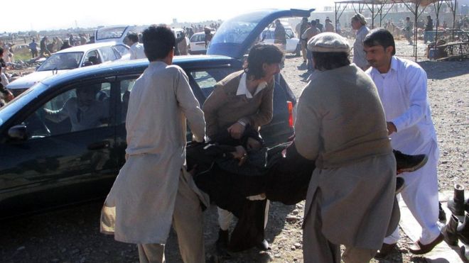 Pakistani men evacuated the injured in Parachinar