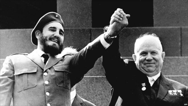 Fidel Castro shown in file photo dated May 1963 holding the hand of Soviet leader Nikita Khrushchev during an offical visit to Moscow