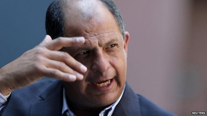 Centre-left presidential candidate Luis Guillermo Solis cruised to victory in the run-off election - _74038382_021779607-1