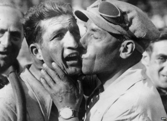 Gino Bartali is congratulated by Costante Girardengo after winning the eleventh stage of the Tour de France