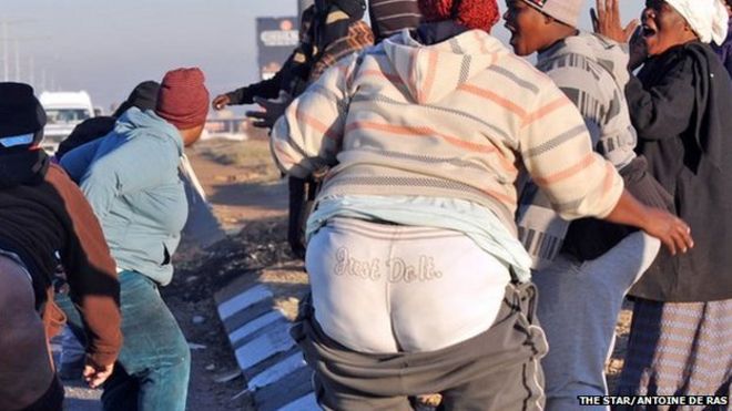 South African protesters in Soweto pulling down their trousers - Wednesday 11 June 2014