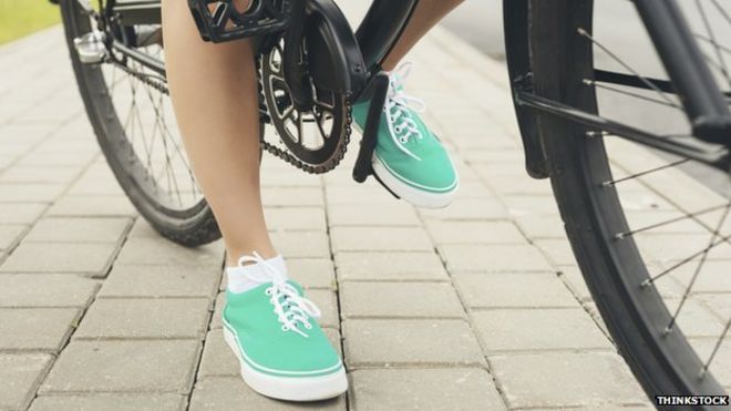 Shoes of a woman on a bike