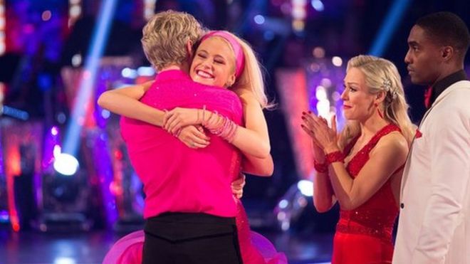 Pixie Lott hugs dance partner Trent Whiddon as she's voted off the show while Simon Webbe and Kristina Rihanoff look on