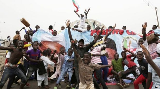 Residents celebrate the anticipated victory of Presidential candidate Muhammadu Buhari in Kaduna, Nigeria 31 March 2015