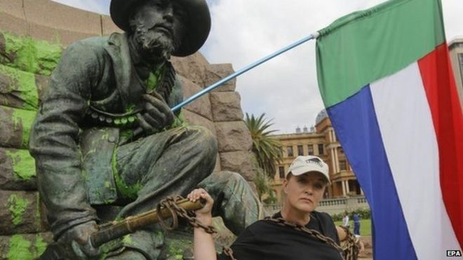 South African singer and Afrikaner activist, Sunette Bridges, chains herself to the statue of Afrikaner hero Paul Kruger in central Pretoria, South Africa, 8 April 2015