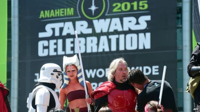 Fans dressed in costumes attend on the opening day of the 25th Star Wars Convention on 16 April, 2015 in Anaheim, California