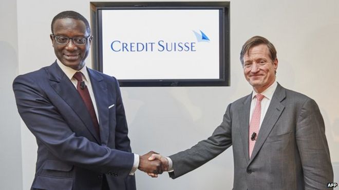 Credit Suisse CEO Brady W. Dougan (R) and Credit Suisse designated CEO Tidjane Thiam shake hands at the end of a press conference on March 10, 2015 in Zurich