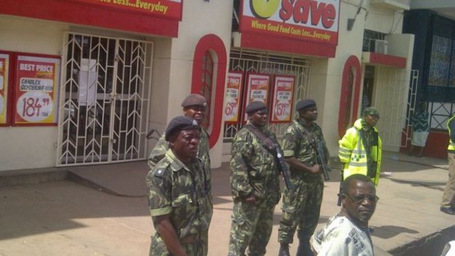 police guard South African shops in Blantyre were under heavy security on Friday