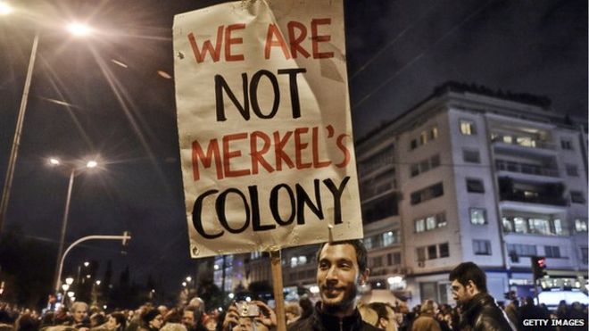 "We are not Merkel's colony" banner