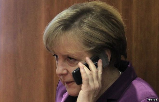 File pic of Angela Merkel with mobile phone