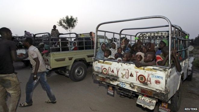 Women and children rescued from Boko Haram in Sambisa forest by the Nigeria military arrive by truck at the internally displaced people's camp in Yola on 2 May 2015