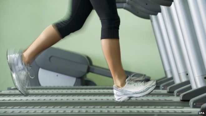 A woman running on a treadmill