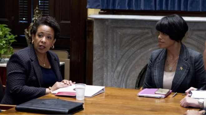 Loretta Lynch and Stephanie Rawlings-Blake sitting at a table