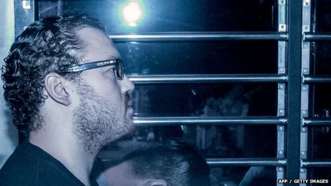 British banker Rurik Jutting accused of the murders of two Indonesian women, sits in a prison van as he arrives at the eastern court in Hong Kong 8 May 2015