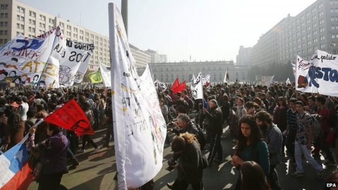 Thousands of demonstrators participate in a rally demanding changes in the education policies supported by President Michelle Bachelet, Chile, 14 May 2015