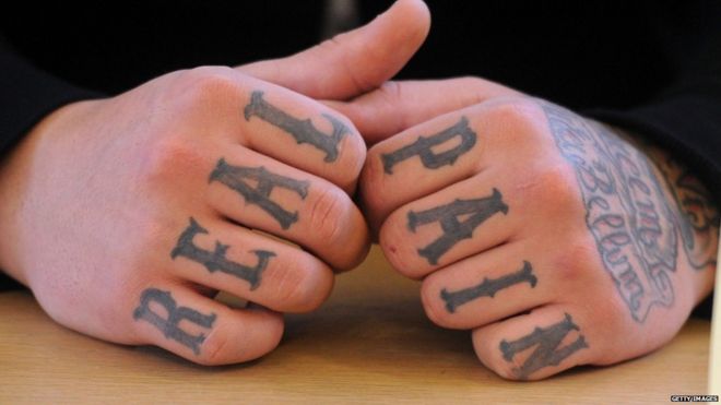 his picture taken on January 7, 2013 shows tattooed hands of a defendant rocker at a court in Pforzheim, western Germany.