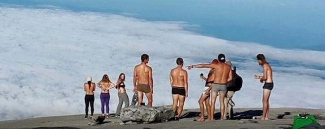 Screen grab taken from Facebook page showing tourists posing on top of Mount Kinabalu in Malaysia