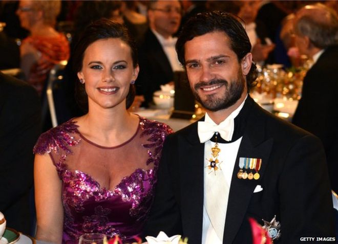 Prince Carl Philip of Sweden (right) and his fiancee Sofia Hellqvist at the Nobel banquet at the Stockholm City Hall on 10 December 2014.