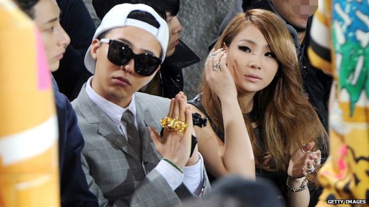 CL at a fashion show with fellow K-pop star G-Dragon