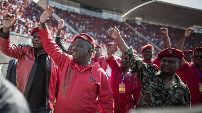 South Africa's Economic Freedom Fighters leader Julius Malema waves at supporters during a provincial electoral campaign rally in Pretoria on 4 May 4 2014