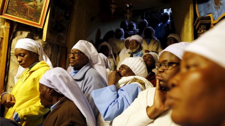 Nigerian pilgrims pray inside the Church of the Nativity during Christmas celebrations in the West Bank town of Bethlehem December 24, 2015