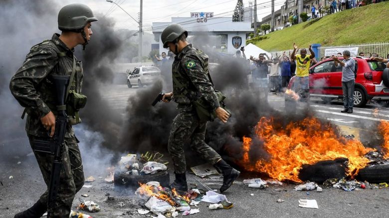 soldiers in front of a fire