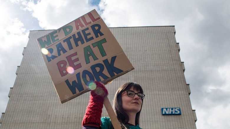 Junior doctor holding a placard