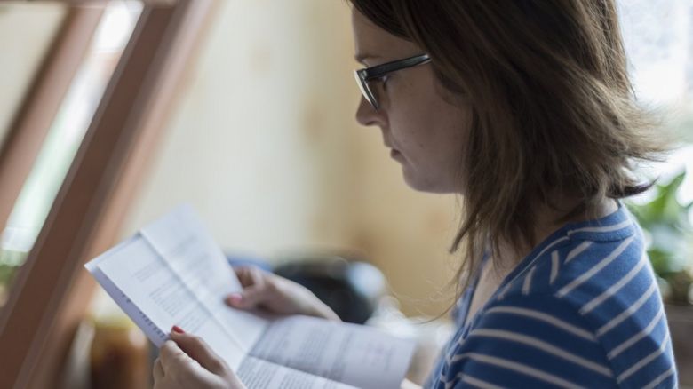 Woman looking at a letter
