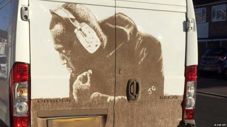 Stormzy in mud on a white van