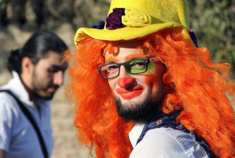 This undated picture from media activist Ahmad al-Khatib shows Syrian social worker Anas al-Basha, 24, dressed as a clown while posing for a photograph in Aleppo, Syria