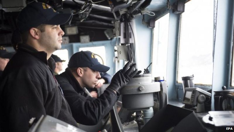US Navy sailors monitor the area aboard US Navy's USS Vicksburg participating in NATO's Dynamic Mongoose anti-submarine exercise in the North Sea off the coast of Norway