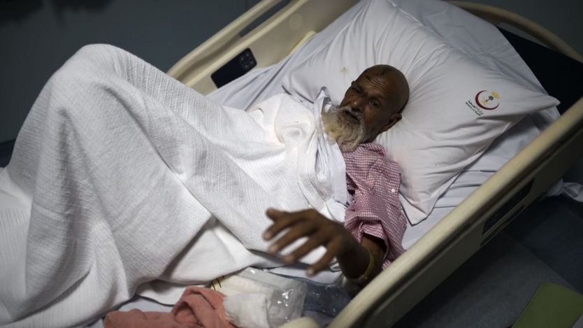 An injured pilgrim prepares is admitted at an emergency hospital following a deadly stampede in Mina
