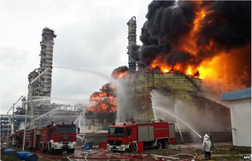 Firefighters battle a blaze following an explosion at a plant producing paraxylene - a chemical commonly known as PX - in Zhangzhou, east China's Fujian province on 8 April 2015