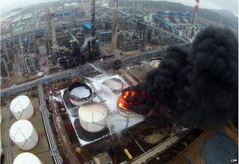 Firefighters battle a fire at the explosion site of PX chemical plant on 7 April 2015 in Zhangzhou