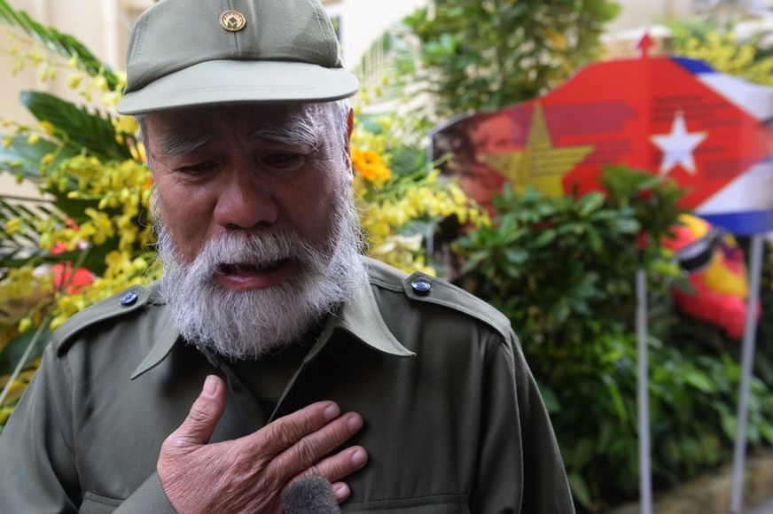 Vietnamese veteran Nguyen Van Hai, 70, cries as he speaks of his feelings after paying tribute to the Cuban leader Fidel Castro at the Cuban embassy in Hanoi on December 4, 2016.