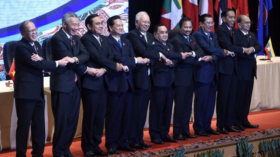 Asean leaders link arms for a group photo